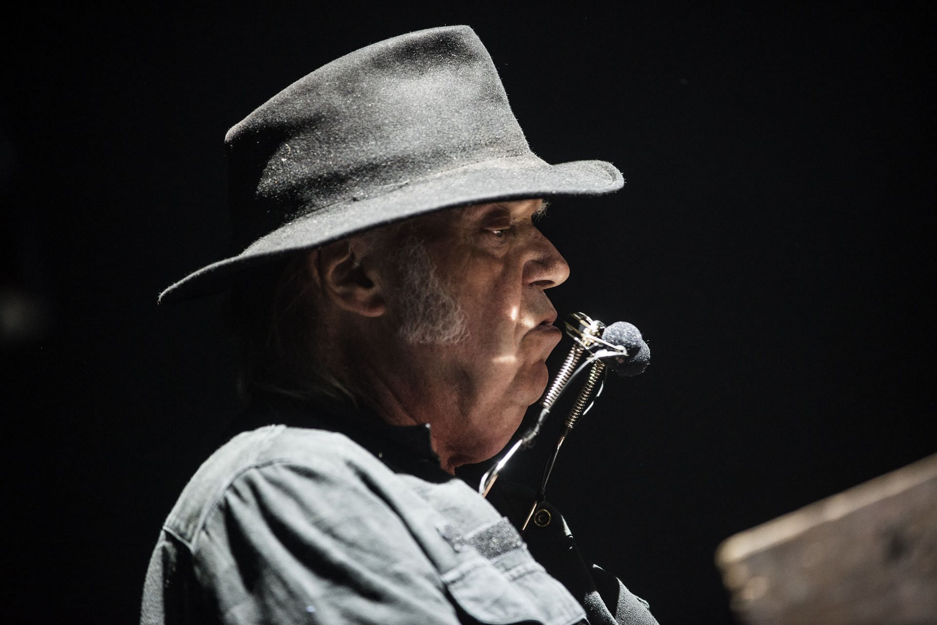 Neil Young performs at SSE Hydro in Glasgow (Image via Getty)